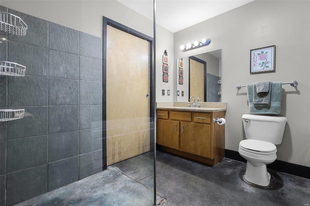 bathroom with vanity, concrete floors, walk in shower, and toilet