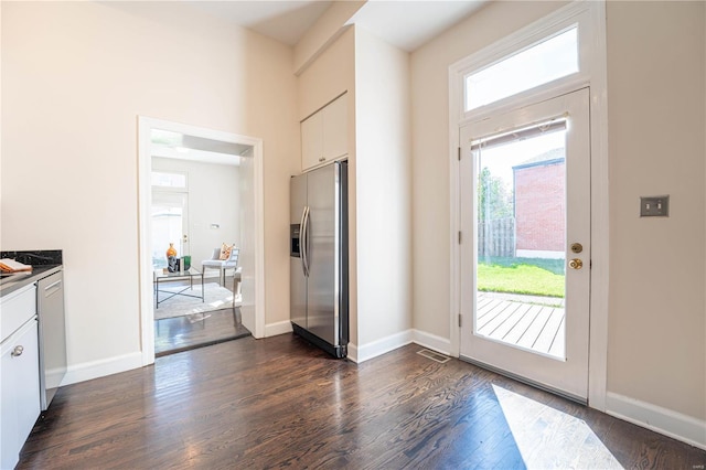 doorway to outside with dark hardwood / wood-style flooring