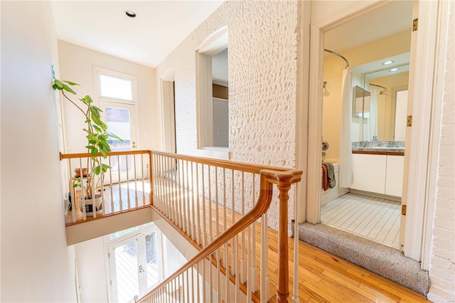 corridor with hardwood / wood-style floors