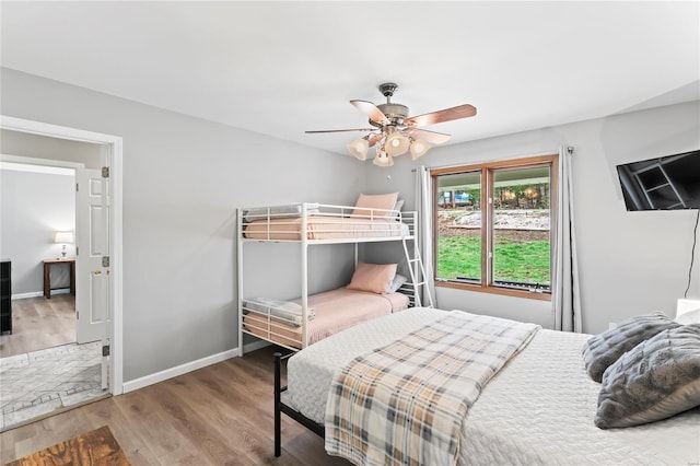 bedroom with wood-type flooring and ceiling fan