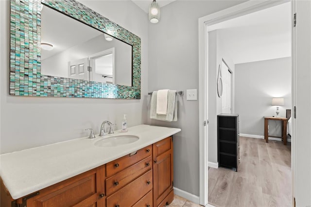 bathroom featuring vanity and hardwood / wood-style flooring