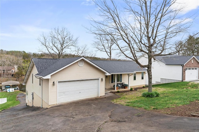 ranch-style house with a garage and a front lawn