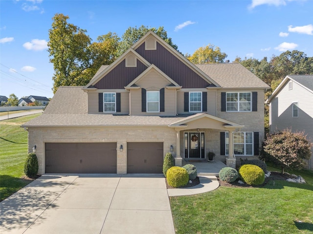 view of front of property with a front yard and a garage