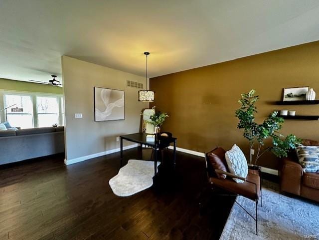 dining area with a ceiling fan, wood finished floors, visible vents, and baseboards