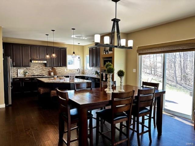 dining space with dark wood-style floors