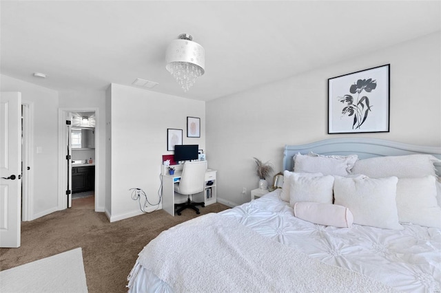 bedroom with visible vents, baseboards, an inviting chandelier, and carpet flooring