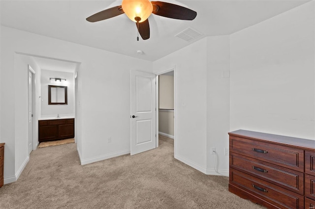 unfurnished bedroom with visible vents, light colored carpet, and baseboards