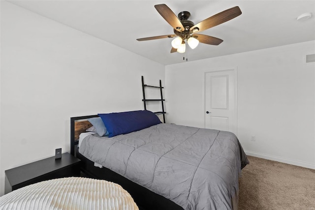 carpeted bedroom featuring visible vents, ceiling fan, and baseboards