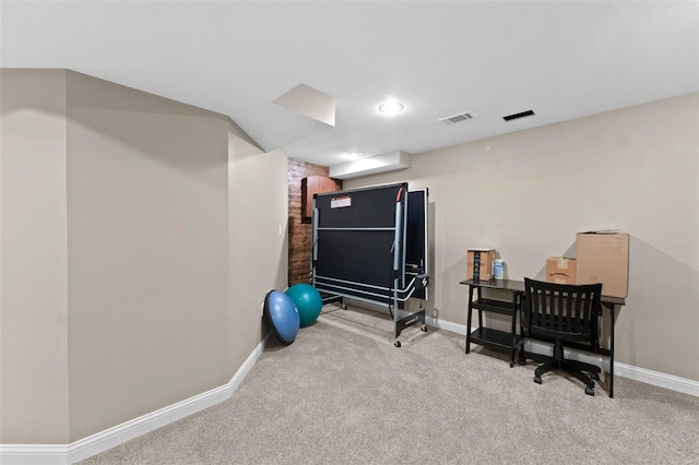 workout area featuring visible vents, baseboards, and carpet