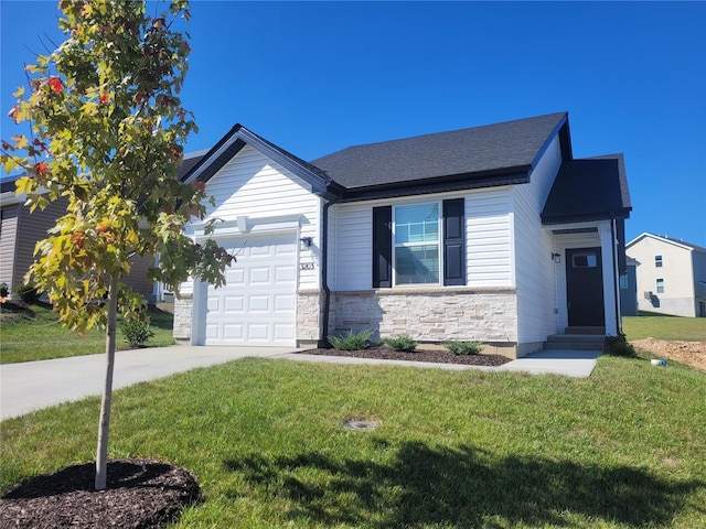 view of front of house with a front lawn and a garage