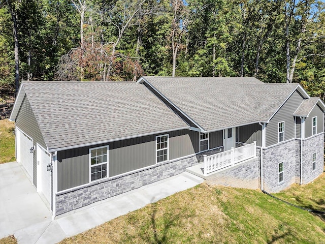 view of front of property with a garage and a front lawn