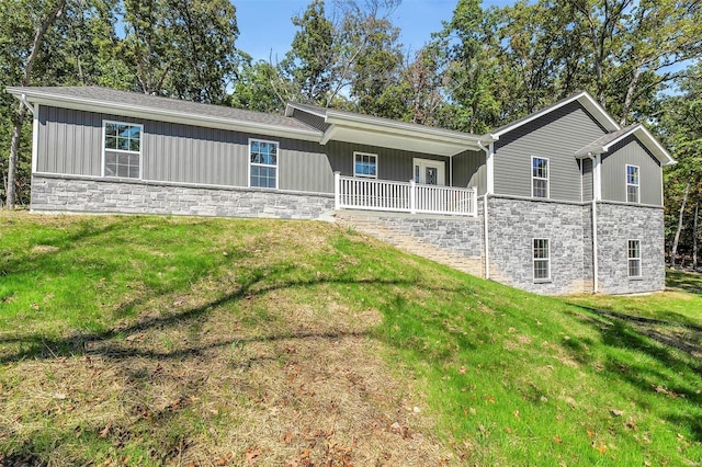 rear view of house with a yard