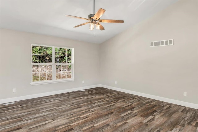 unfurnished room with ceiling fan and dark hardwood / wood-style flooring