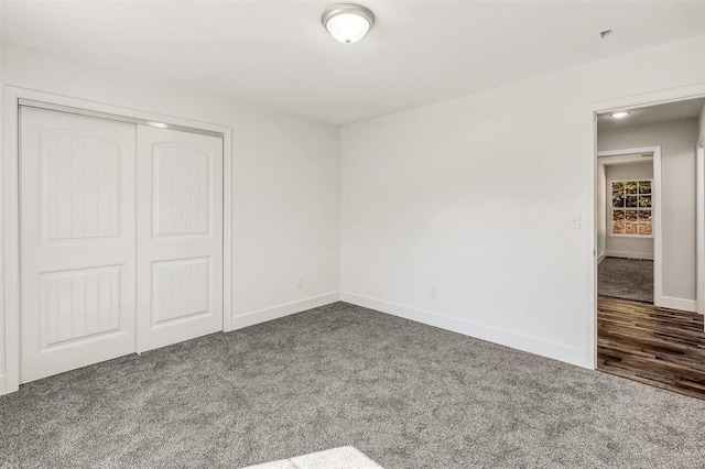 unfurnished bedroom with carpet floors and a closet