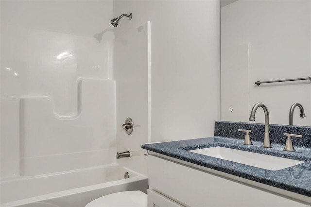 full bathroom with vanity, toilet, and shower / washtub combination