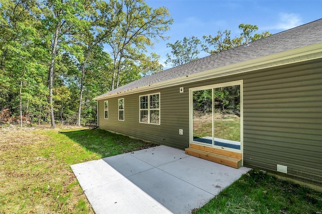 exterior space with a lawn and a patio area