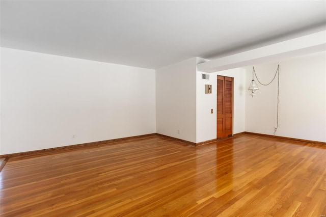 empty room with wood-type flooring