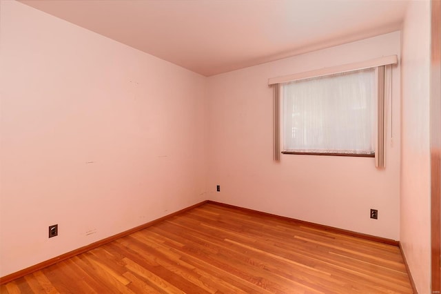 unfurnished room featuring light hardwood / wood-style floors