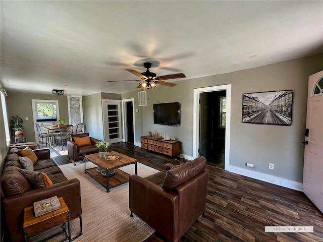 living room with wood-type flooring and ceiling fan