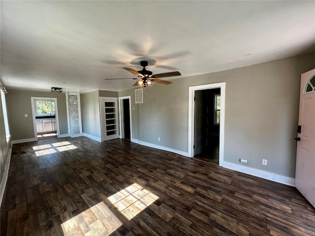 unfurnished living room with ceiling fan and dark hardwood / wood-style floors