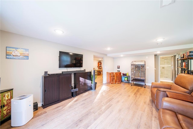 living room with light hardwood / wood-style flooring