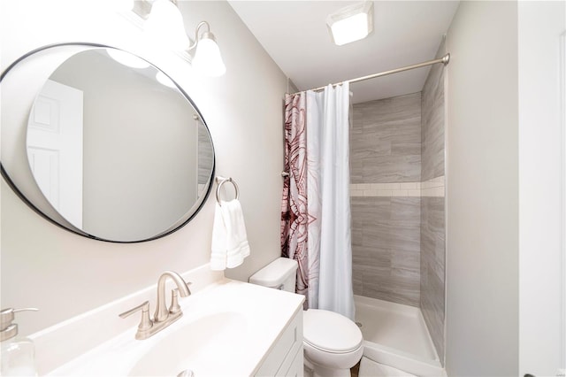 bathroom with vanity, toilet, and curtained shower