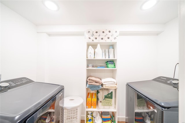 laundry room with separate washer and dryer