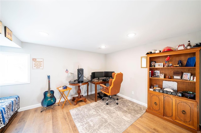 office with light hardwood / wood-style flooring