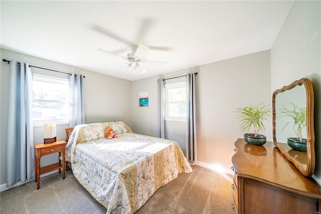 bedroom with ceiling fan and carpet flooring