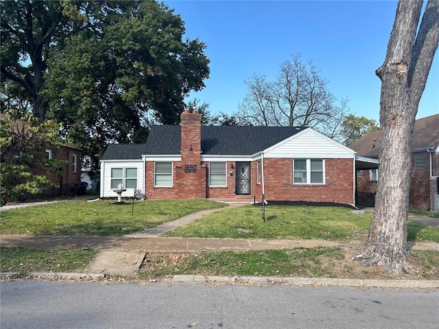 view of front facade featuring a front yard and a carport