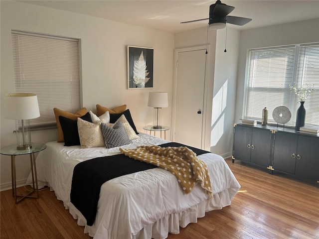 bedroom featuring hardwood / wood-style floors and ceiling fan