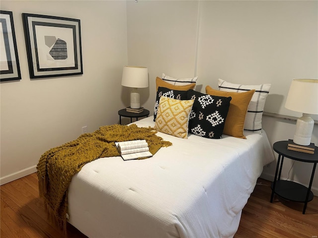 bedroom featuring hardwood / wood-style floors