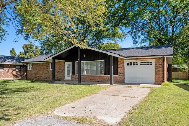 ranch-style house featuring a front yard and a garage