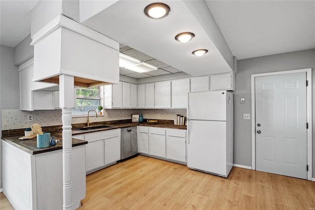 kitchen featuring white refrigerator, light wood-type flooring, sink, white cabinets, and stainless steel dishwasher