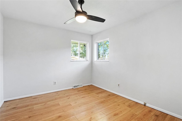 unfurnished room featuring light hardwood / wood-style flooring and ceiling fan