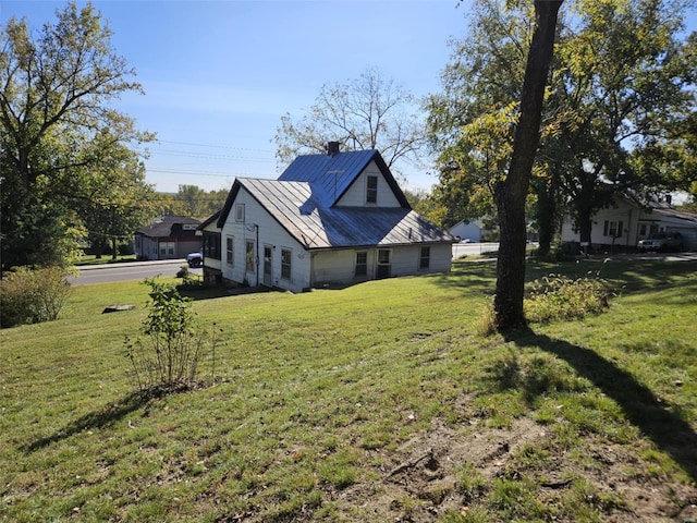 view of property exterior featuring a lawn