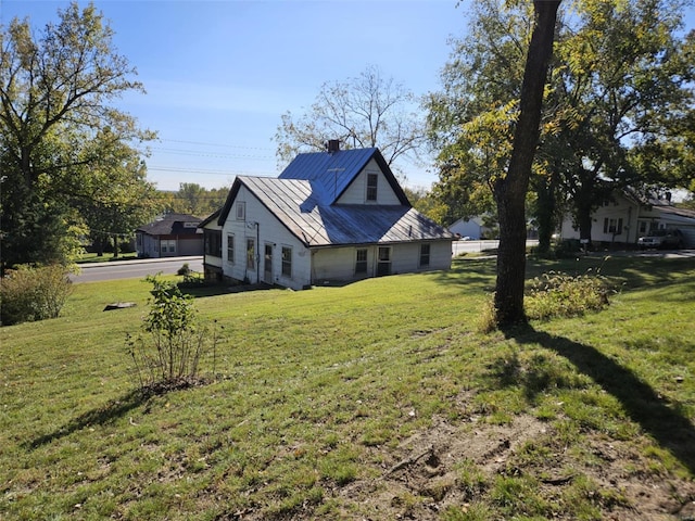 view of property exterior with a lawn