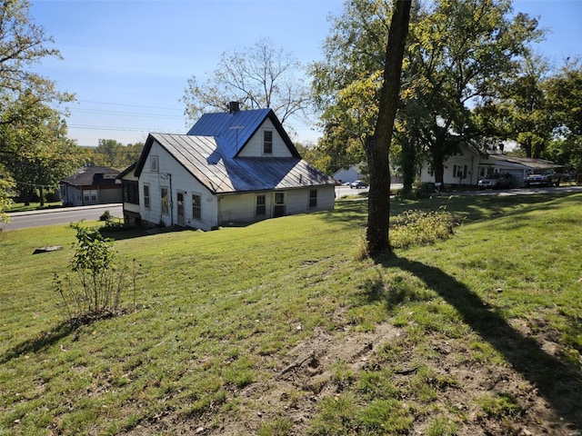 view of property exterior with a yard