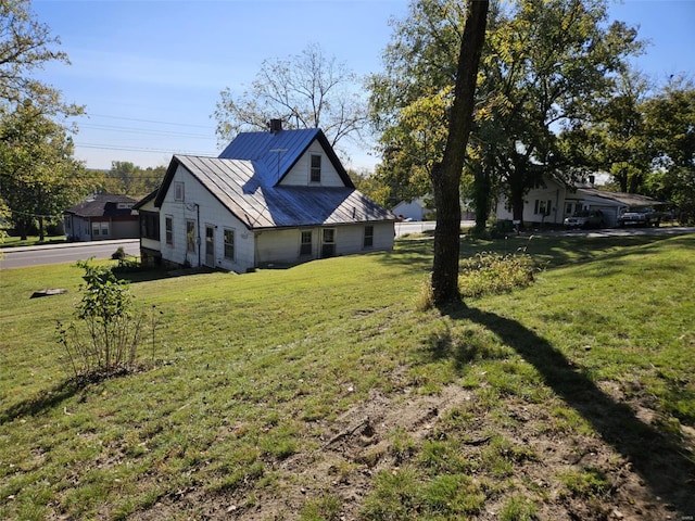 view of home's exterior featuring a lawn