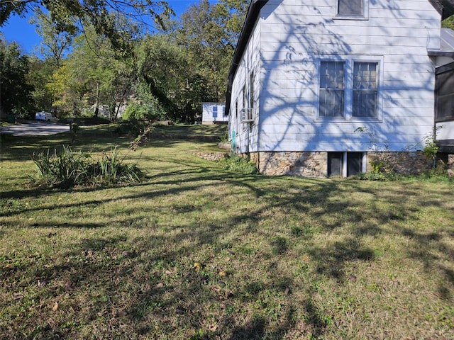 view of home's exterior with a yard