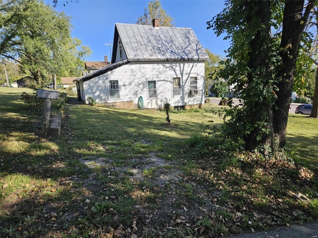 view of property exterior with a yard