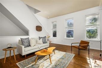 sitting room featuring vaulted ceiling and dark hardwood / wood-style flooring