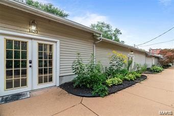 view of home's exterior featuring french doors and a patio area