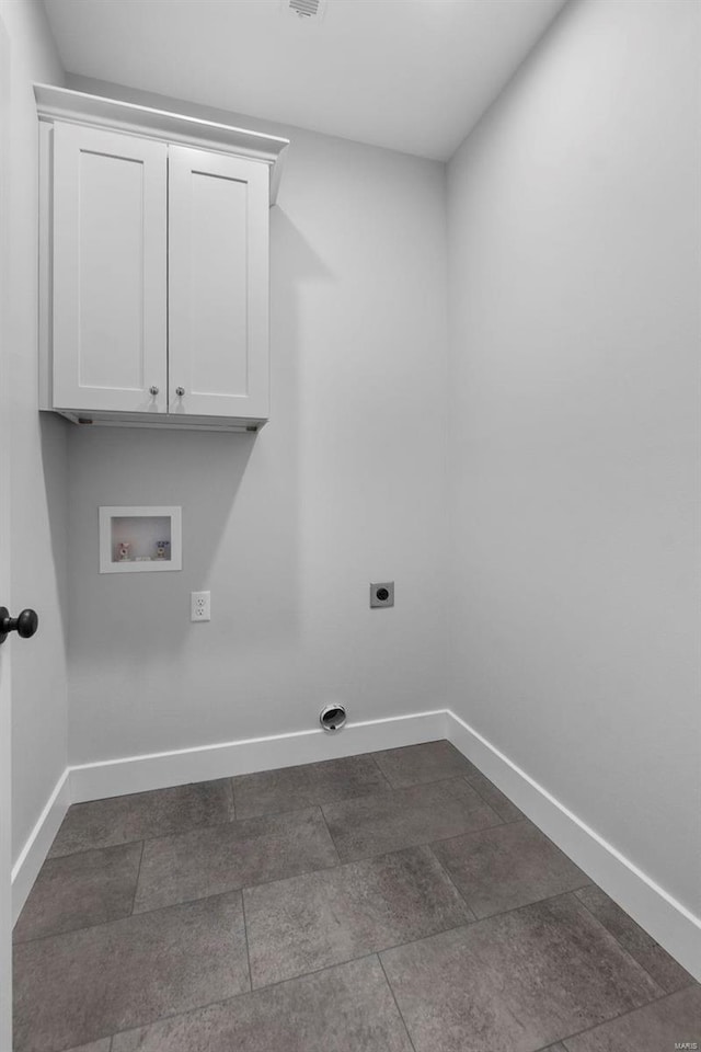 laundry area with cabinet space, baseboards, washer hookup, and electric dryer hookup