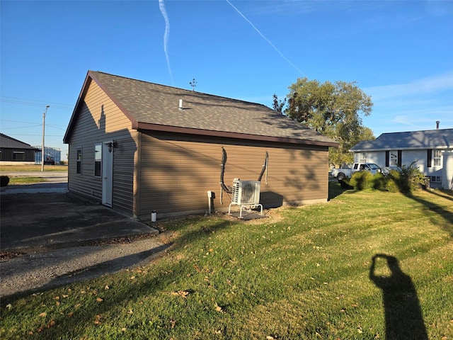 view of side of property featuring a yard