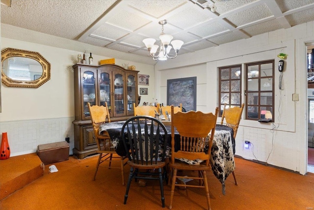 dining space featuring a notable chandelier