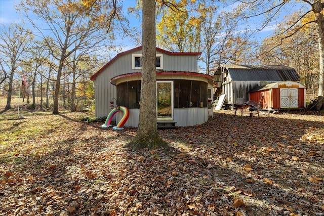 view of outdoor structure with a sunroom