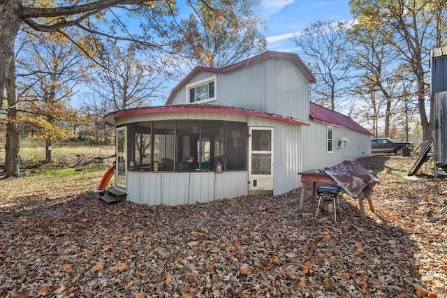 view of home's exterior featuring a sunroom