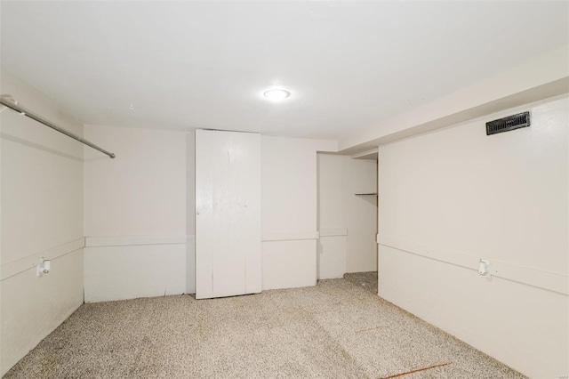 basement with light colored carpet