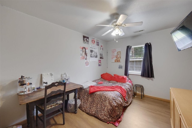 bedroom featuring ceiling fan and light hardwood / wood-style floors